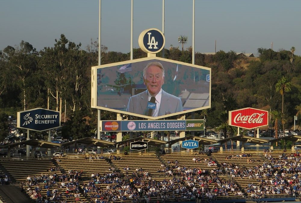 Longtime LA Dodgers announcer Vin Scully appears on a screen June 26, 2014, as the Dodgers took on the St. Louis Cardinals at Dodger Stadium. Longtime LA Dodgers announcer Vin Scully appears on a screen June 26, 2014, as the Dodgers took on the St. Louis Cardinals at Dodger Stadium.